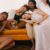 Diverse Beauty - Photo of Women Sitting on Orange Sofa