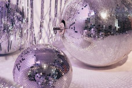 Fashion Icons - Silver and Purple Baubles on White Textile