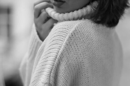 Style Defines - Black and White Picture of a Young Woman in a Sweater