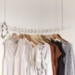 Fashion - assorted clothes in wooden hangers