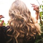 Fashion Highlights - Blonde-haired Woman Standing Between Green Plants