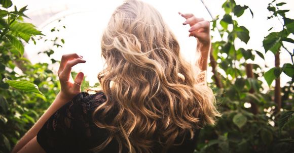 Fashion Highlights - Blonde-haired Woman Standing Between Green Plants