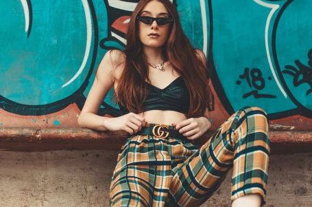 Street Style - Woman Leaning on Graffiti Wall