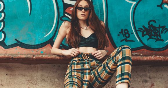 Street Style - Woman Leaning on Graffiti Wall