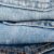 Quality Revolution - Stack of blue jeans arranged by color